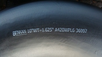 A 90° elbow manufactured to ASTM A420 Gr. WPL6